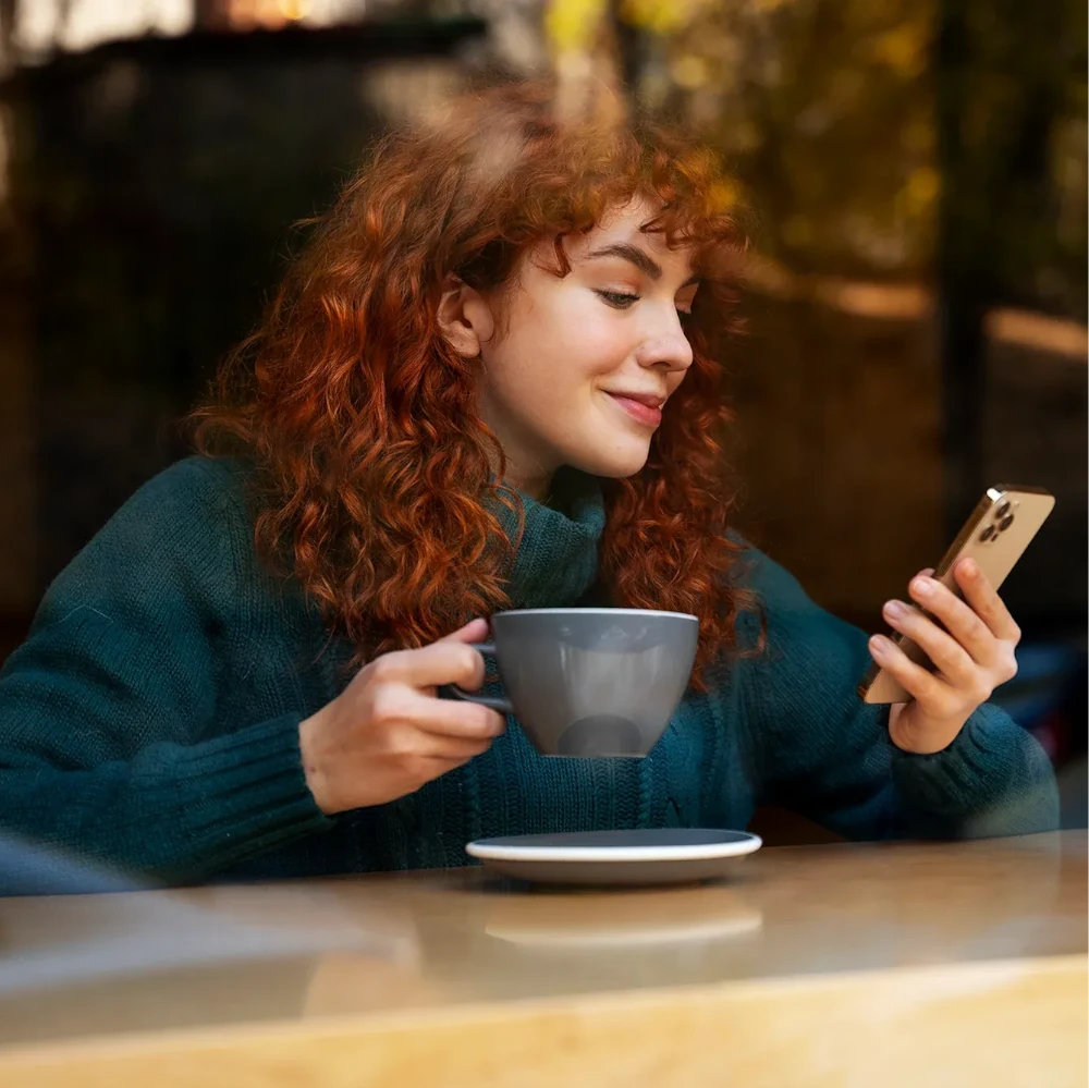 A female bar worker pulling a pint