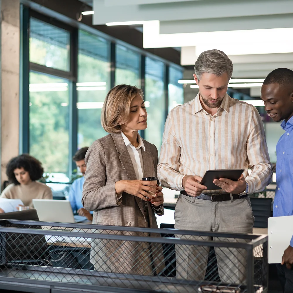 Executives discussing cloud computing and maintaining mainframes